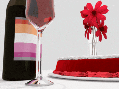 a bottle of wine sits next to a wine glass and a cake