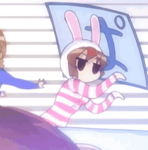a girl in a bunny costume is holding a pillow with a letter t on it
