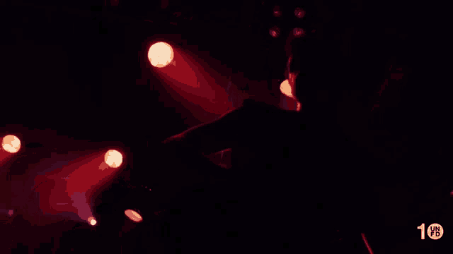 a silhouette of a person in a dark room with the number 10 on the bottom right corner