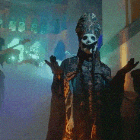 a person in a skeleton costume is standing in front of a microphone in a dark room .