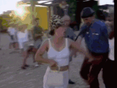 a blurry picture of a woman in a white dress and a man in a blue uniform
