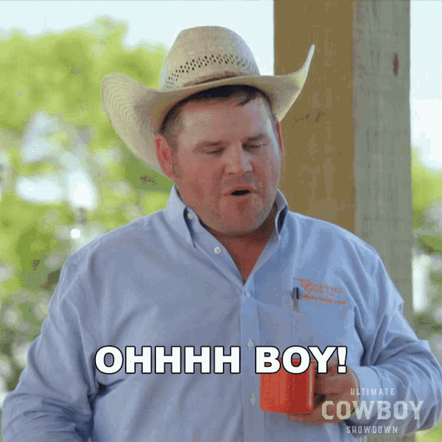 a man in a cowboy hat is holding a red cup and says ohhhh boy