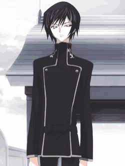 a man in a black jacket and black pants is standing in front of a building