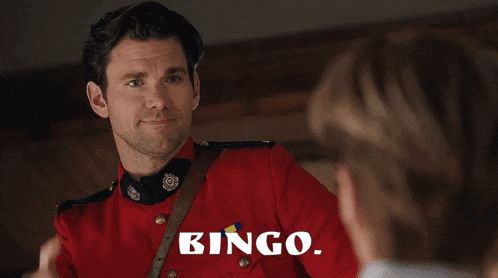a man in a red uniform is talking to a woman and the word bingo is on the bottom