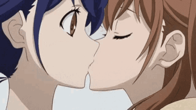 a couple of anime characters are kissing each other .