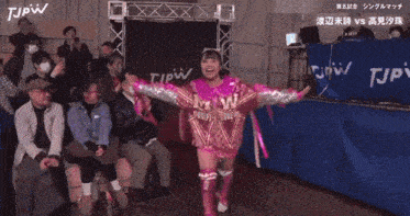 a girl in a sequined outfit with the word m1w on it