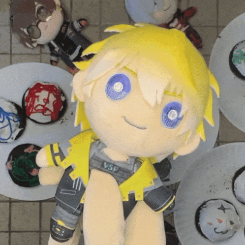 a stuffed toy with yellow hair and blue eyes says vsf