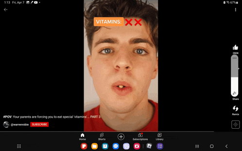 a screen shot of a young man with the words vitamins xx written on his forehead