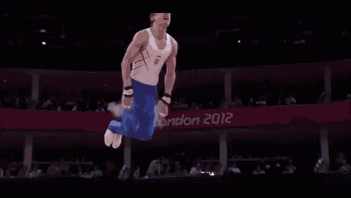 a gymnast is jumping in the air during a competition at the london olympics .