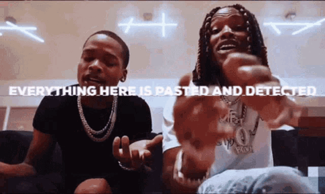 two men are sitting next to each other with the words " everything here is pasted and detected " behind them