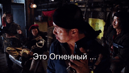 a man in a black hat holds a gun and the word dragon is on his chest