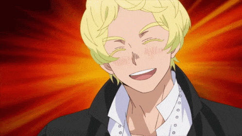 a man with blonde hair and a black jacket smiles with his eyes closed