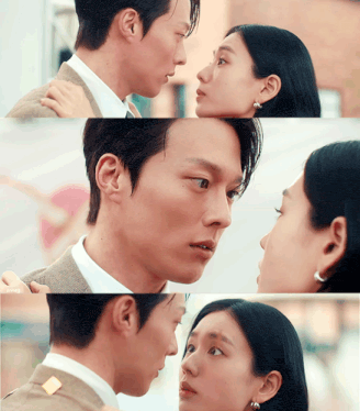 a man and a woman are looking at each other with their eyes closed