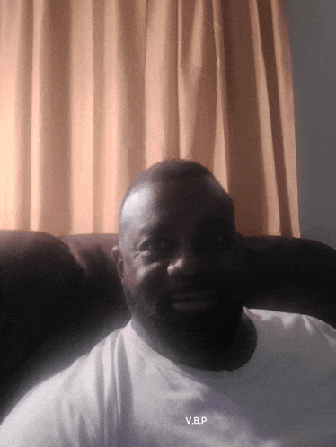 a man in a white shirt with the name v.b.p. on it