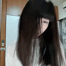a woman with long hair is wearing headphones