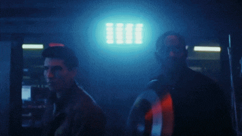 a group of soldiers are fighting in a dark room and one of them is holding a gun