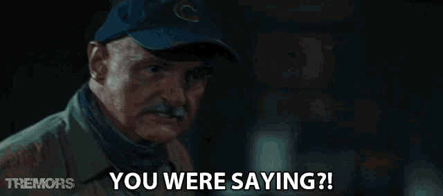 a man wearing a baseball cap with the letter c on it says you were saying