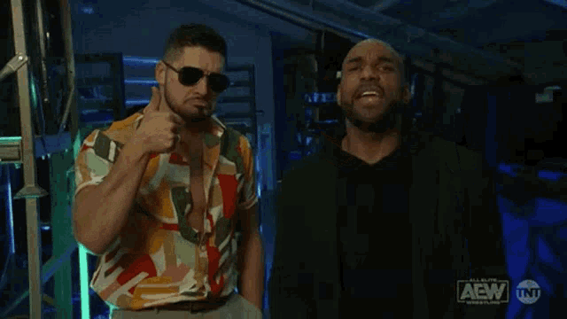 two men are standing next to each other and one of them is saying " good job "