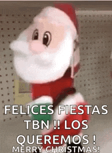a stuffed santa claus with the words felices fiestas tbn los queremos merry christmas