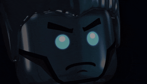 a close up of a lego figure with blue eyes