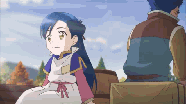a girl with blue hair sitting next to a man