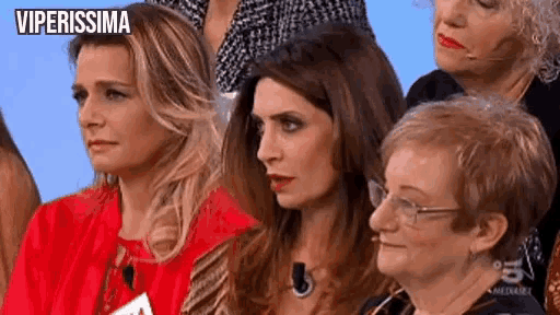 a group of women are sitting in front of a blue background and the words viperissima are on the bottom