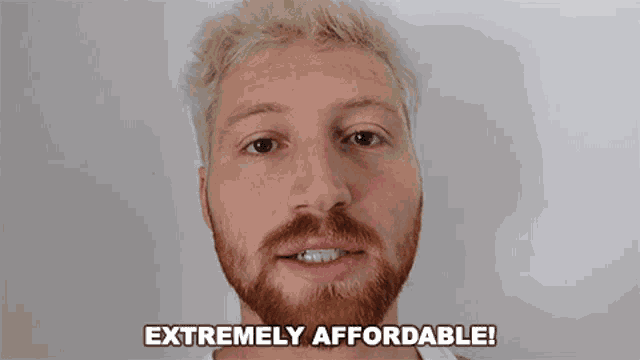 a man with blonde hair and a red beard is saying extremely affordable