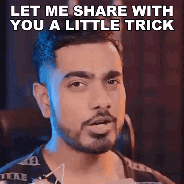 a man with a beard is saying let me share with you a little trick