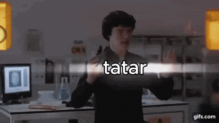 a man standing in front of a computer with the word tatar written on the screen