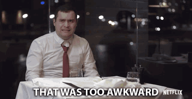 a man sitting at a table with the words that was too awkward netflix written on the bottom