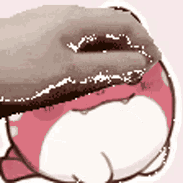 a close up of a person 's mouth with a hand on it .