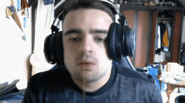 a man wearing headphones and a shirt that says reebok