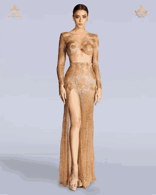 a woman is wearing a gold dress with the word miss on it
