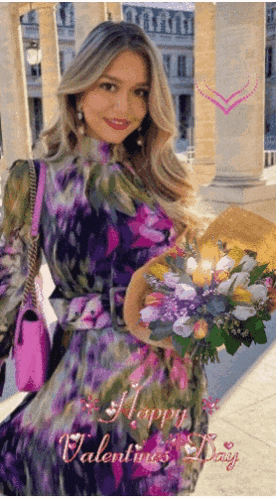 a woman in a purple dress holding a bouquet of flowers