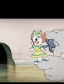 a person is holding a toy mouse in their hand in a cartoon scene .