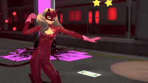 a woman in a red catsuit and mask is dancing in front of a train