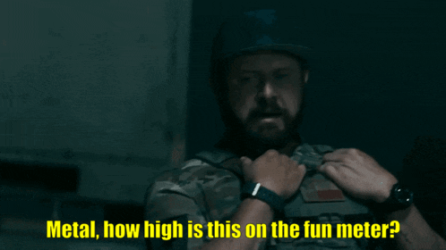 a man in a military uniform is talking to a woman in a dark room and the words metal how high is this on the fun meter