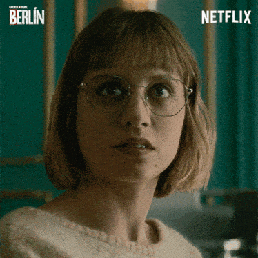 a close up of a woman wearing glasses and a netflix logo