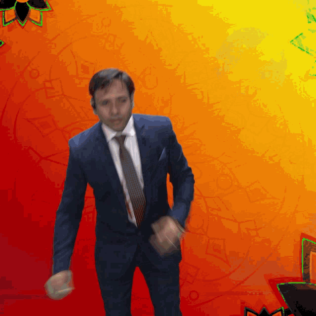 a man in a suit and tie is dancing