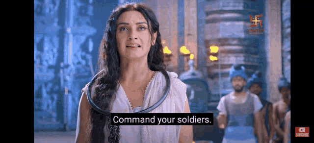 a woman in a white dress is standing in front of a group of soldiers and saying `` command your soldiers '' .