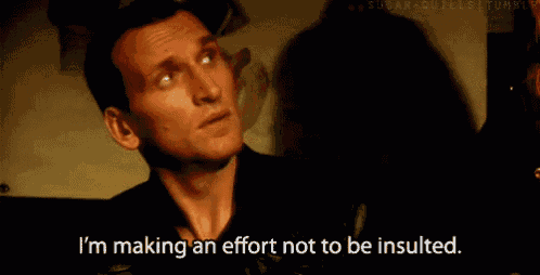 a man in a black shirt is saying i 'm making an effort not to be insulted