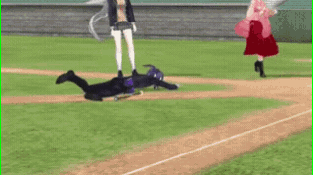 a man is laying on the ground on a baseball field