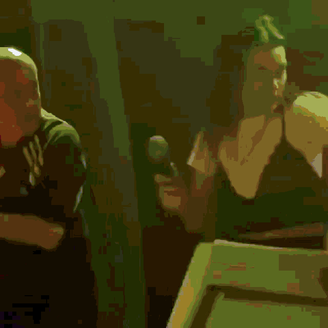 a blurry picture of a man holding a microphone