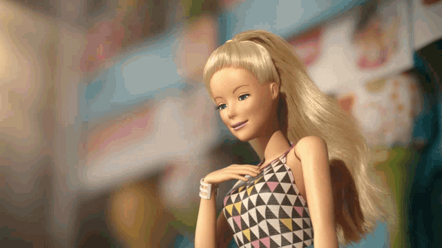 a barbie doll wearing a geometric patterned dress