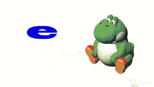 a green frog is sitting next to a blue cd