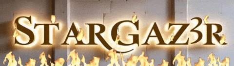 the word stargazer is lit up with flames