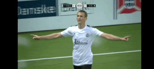 a soccer player wearing a white shirt that says albani