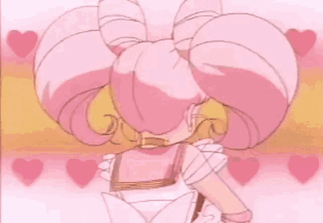 a little girl with pink hair and wings is standing in front of a pink background with hearts .