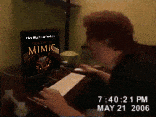 a person is looking at a computer screen that says five night at freddy 's on it