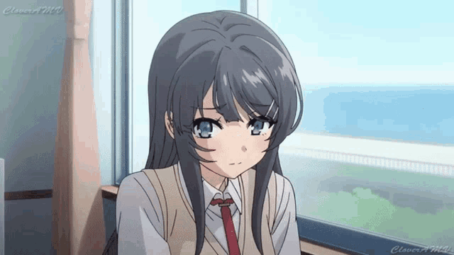 a girl is sitting in front of a window with the word clover written on the bottom